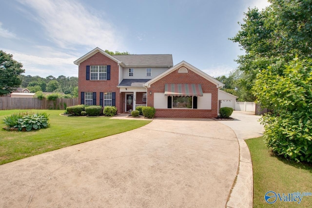 traditional-style house with brick siding and driveway