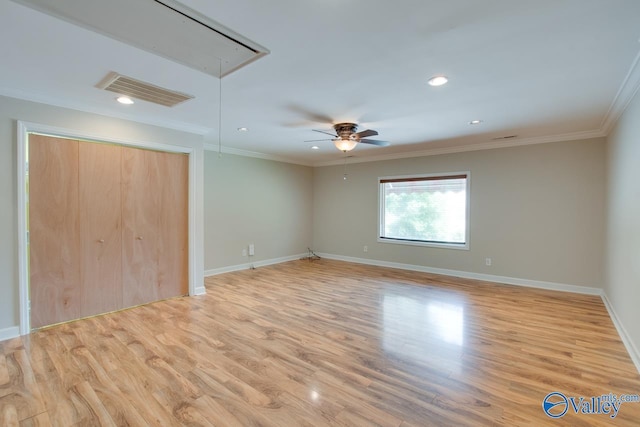 unfurnished bedroom with attic access, light wood-style floors, baseboards, ornamental molding, and recessed lighting