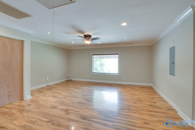 empty room featuring attic access, electric panel, light wood-style floors, recessed lighting, and ceiling fan