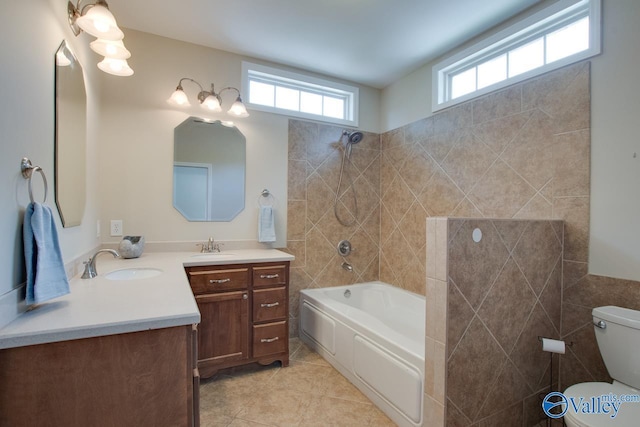 full bath with  shower combination, toilet, tile patterned floors, and vanity