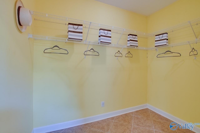 spacious closet featuring tile patterned floors
