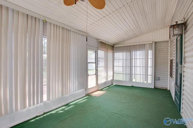 unfurnished sunroom with ceiling fan and lofted ceiling