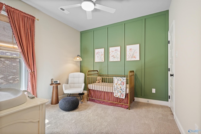 bedroom with ceiling fan, carpet flooring, baseboards, and visible vents