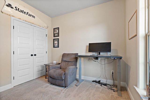 carpeted office with baseboards