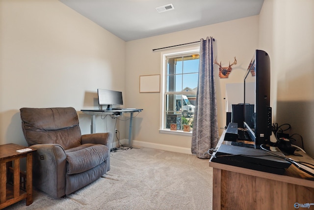 carpeted home office with visible vents, baseboards, and lofted ceiling