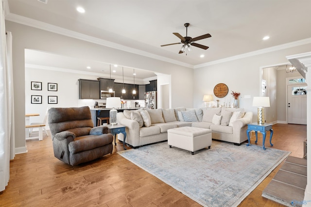 living room with ceiling fan, light wood-style flooring, baseboards, and recessed lighting