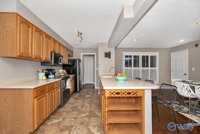 kitchen with open shelves, stainless steel appliances, a sink, and light countertops