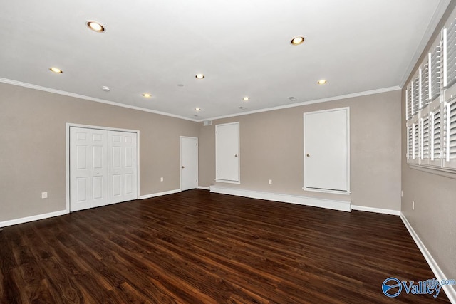 interior space with crown molding, baseboards, dark wood-style flooring, and recessed lighting