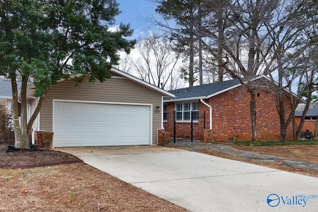 ranch-style home featuring a garage, brick siding, and driveway