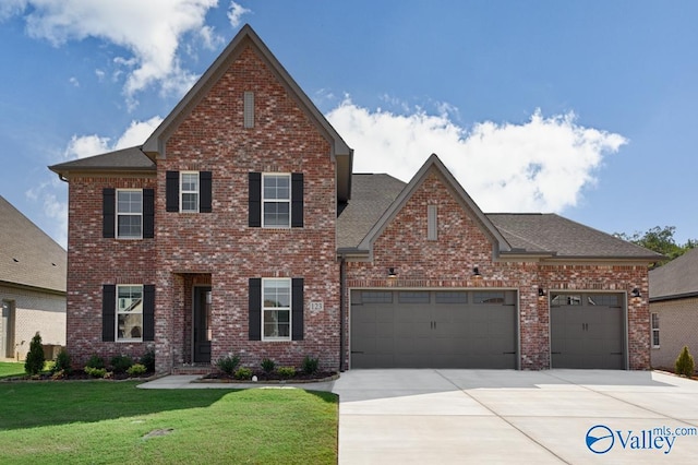 111 Mayapple Trl, Madison, AL 35756 - view of front facade with a garage, driveway, a front lawn, and brick siding