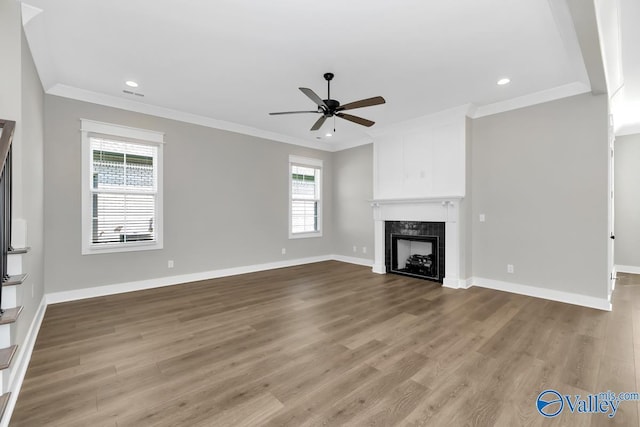111 Mayapple Trl, Madison, AL 35756 - unfurnished living room with crown molding, wood finished floors, a fireplace, baseboards, and ceiling fan