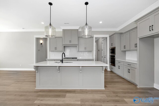 111 Mayapple Trl, Madison, AL 35756 - kitchen featuring a sink, light countertops, gray cabinetry, and stainless steel appliances