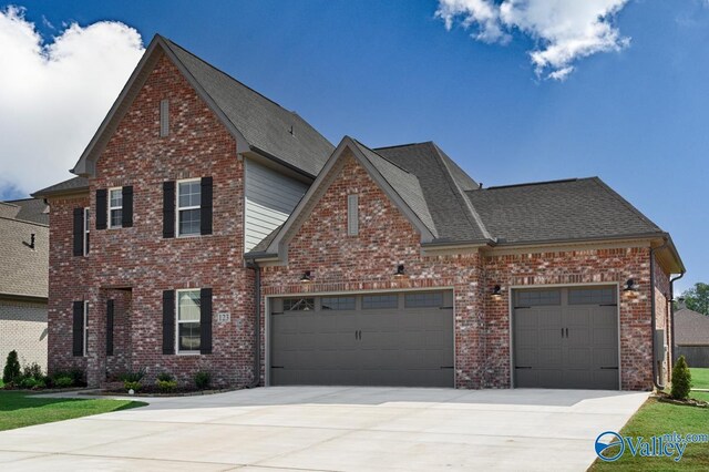 111 Mayapple Trl, Madison, AL 35756 - view of front facade featuring an attached garage, a shingled roof, brick siding, and concrete driveway