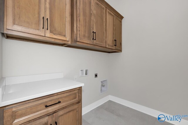 111 Mayapple Trl, Madison, AL 35756 - clothes washing area featuring washer hookup, baseboards, electric dryer hookup, and cabinet space