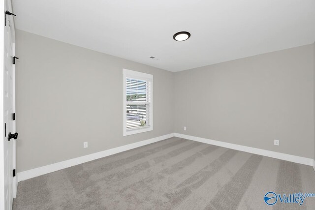 111 Mayapple Trl, Madison, AL 35756 - unfurnished room with baseboards, carpet floors, and visible vents