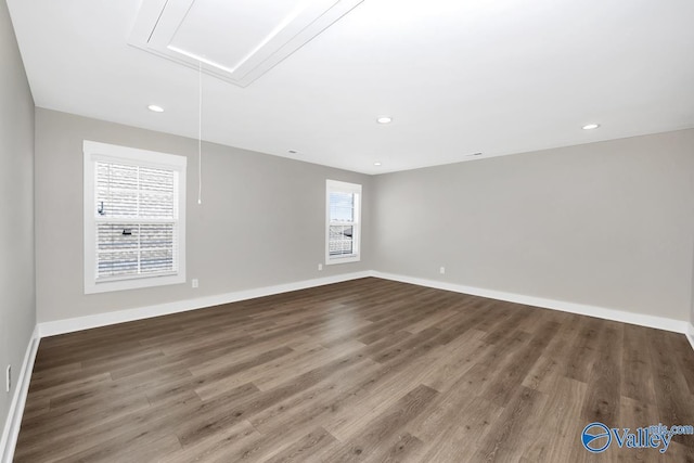 111 Mayapple Trl, Madison, AL 35756 - unfurnished room featuring baseboards, attic access, and wood finished floors