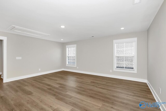 111 Mayapple Trl, Madison, AL 35756 - unfurnished room featuring recessed lighting, attic access, baseboards, and wood finished floors