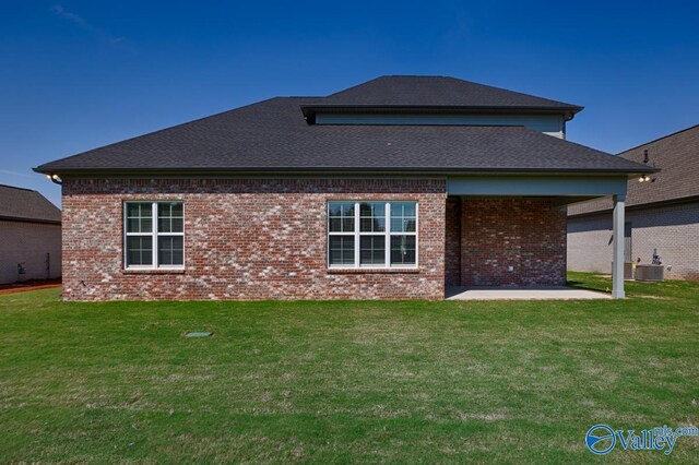 111 Mayapple Trl, Madison, AL 35756 - rear view of house with a yard, a patio area, and brick siding