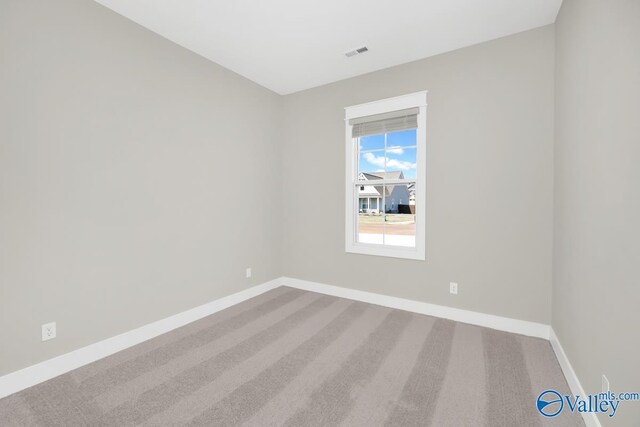 111 Mayapple Trl, Madison, AL 35756 - carpeted spare room featuring baseboards and visible vents