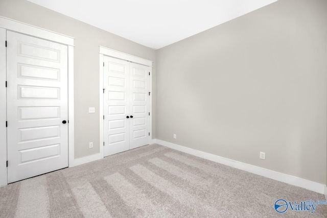111 Mayapple Trl, Madison, AL 35756 - unfurnished bedroom with carpet floors, baseboards, and a closet