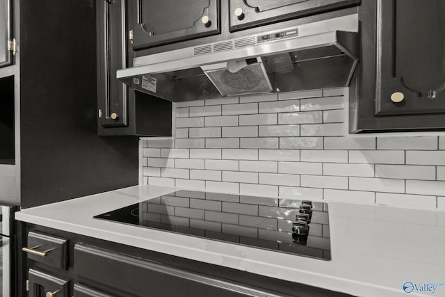 kitchen featuring tasteful backsplash and black electric stovetop