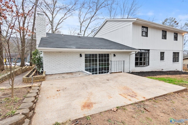 rear view of property featuring a patio area