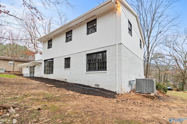 view of property exterior with central AC