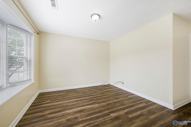 104 Sycamore Pl, Athens, AL 35611 - empty room featuring dark wood-style floors and baseboards