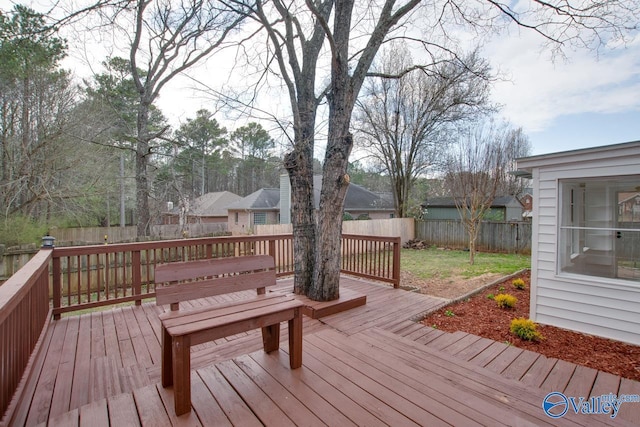 deck with a fenced backyard