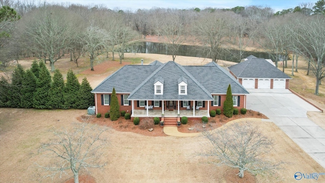 view of front facade with a porch and a garage