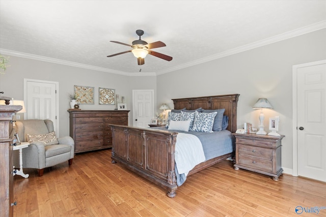 bedroom featuring crown molding, ceiling fan, and light wood-type flooring