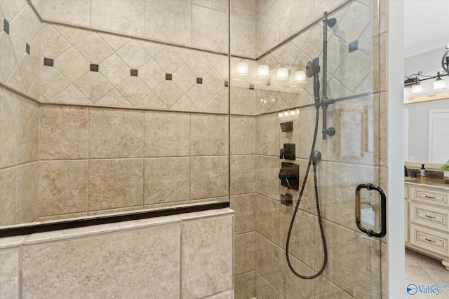 details with vanity, a shower with shower door, and ornamental molding