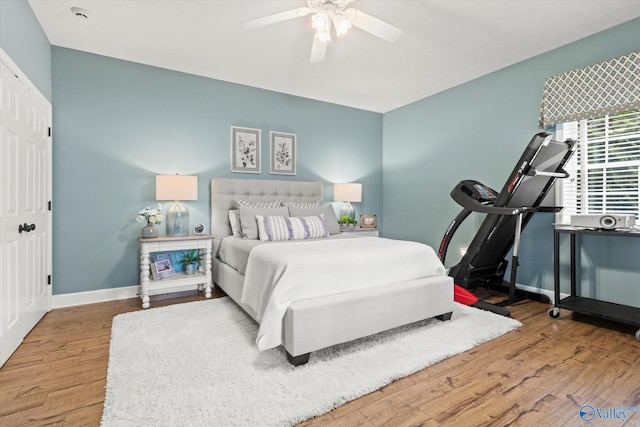 bedroom featuring hardwood / wood-style flooring and ceiling fan