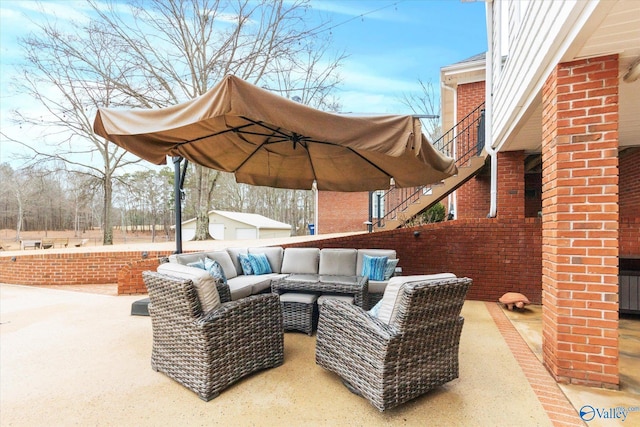 view of patio / terrace featuring an outdoor living space and an outdoor structure