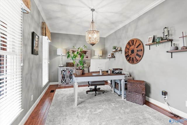 office with crown molding, wood-type flooring, and a chandelier