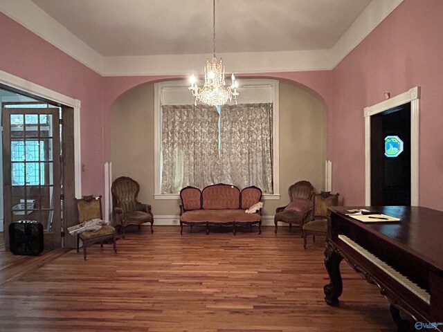 sitting room with a chandelier and hardwood / wood-style flooring