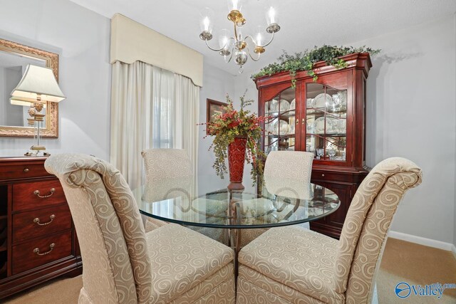 12501 S Shawdee Rd SE, Huntsville, AL 35803 - dining space with a chandelier, carpet floors, and baseboards
