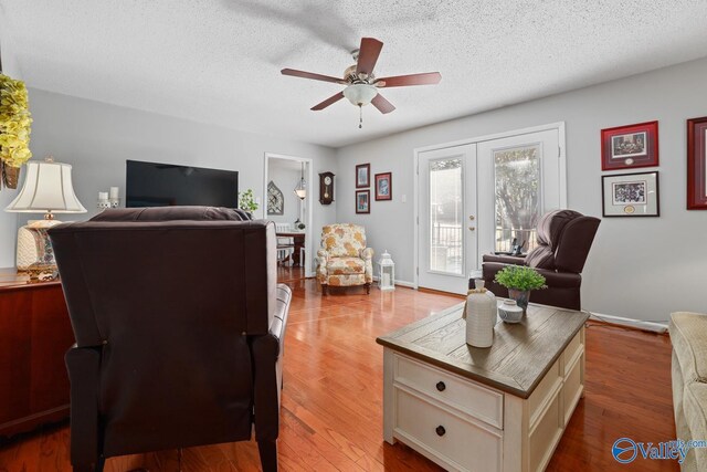 12501 S Shawdee Rd SE, Huntsville, AL 35803 - office featuring ceiling fan, french doors, a textured ceiling, wood finished floors, and baseboards