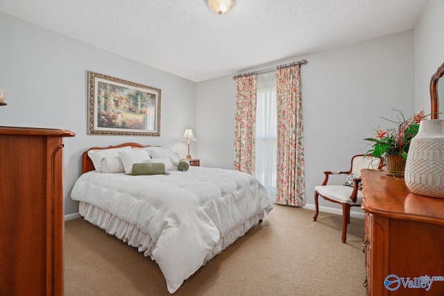 12501 S Shawdee Rd SE, Huntsville, AL 35803 - bedroom with light carpet, a textured ceiling, and baseboards