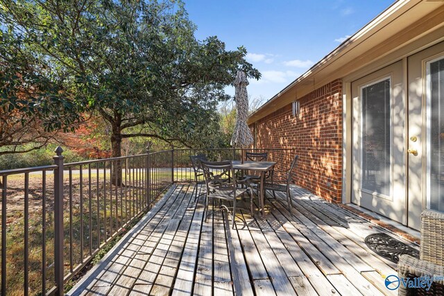 12501 S Shawdee Rd SE, Huntsville, AL 35803 - wooden terrace with outdoor dining area