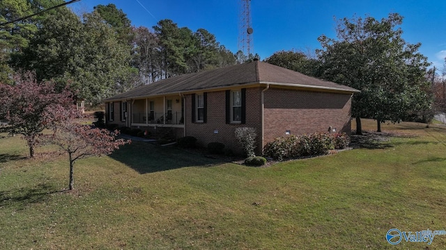 12501 S Shawdee Rd SE, Huntsville, AL 35803 - view of front facade featuring a front yard, brick siding, and covered porch