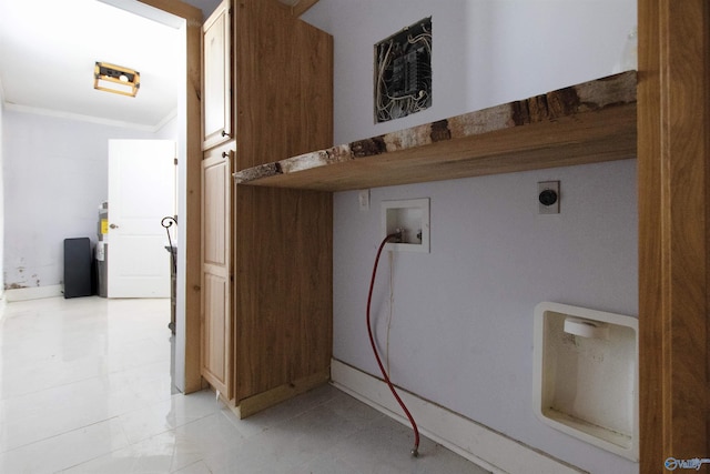 washroom with hookup for a washing machine, crown molding, cabinet space, and hookup for an electric dryer