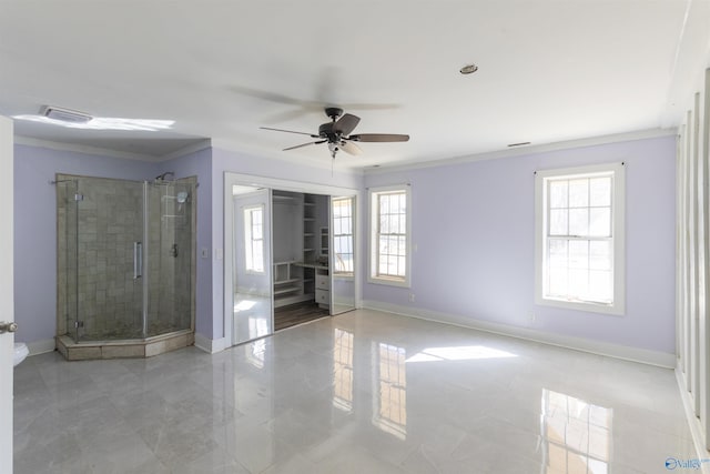 spare room featuring baseboards, plenty of natural light, and ornamental molding