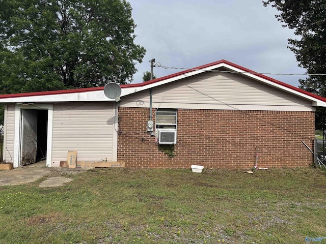 135 Willoughby Dr, New Hope, AL 35760 - view of side of home featuring a yard, brick siding, and cooling unit