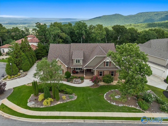 birds eye view of property featuring a mountain view