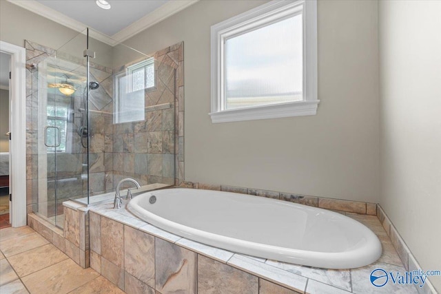 bathroom featuring a bath, a stall shower, and ornamental molding