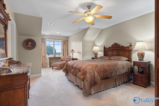 carpeted bedroom with ceiling fan and vaulted ceiling