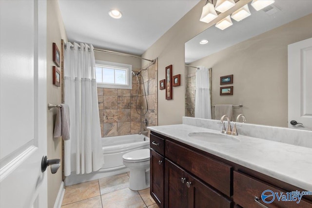 bathroom featuring shower / tub combo, toilet, vanity, and tile patterned floors