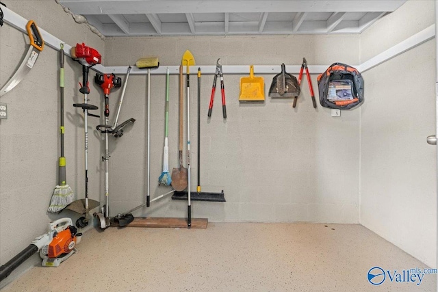 garage with concrete block wall