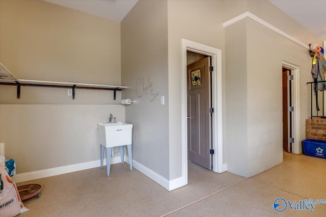 interior space featuring baseboards